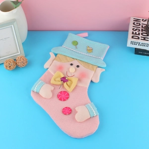 Creative cartoon Christmas stockings in pink and blue displayed on a festive background