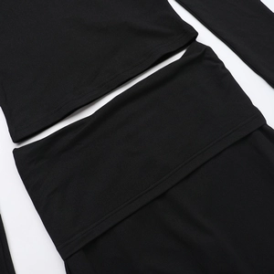 Detailed close-up of black two-piece set featuring lace stitching and V-neckline texture