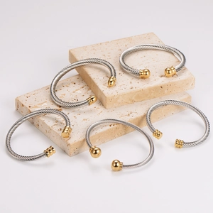 Two-tone stainless steel cable wire open bangles with gold and silver finish details