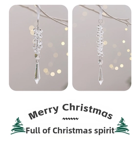 Close-up of crystal acrylic ice pendants with white ribbons for Christmas tree decor