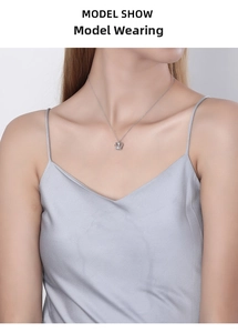 Elegant S925 silver crown necklace on model, showcasing fine zircon details and length