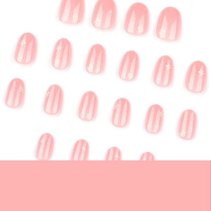 Short round press-on nails in peach pink with glitter stripes and small white flowers
