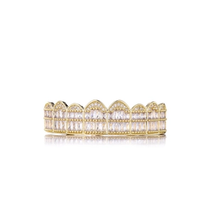 Detailed close-up of hiphop gold grillz with double rows of sparkling white zircons