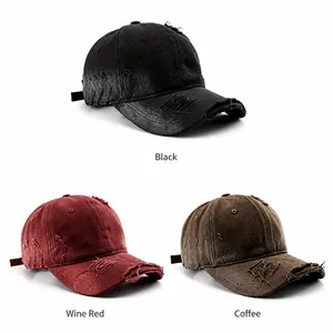 Close-up of distressed cotton baseball caps in black, burgundy, and coffee colors