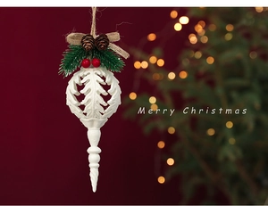 Christmas tree ornament with white base, pine needles, red berries and Merry Christmas text