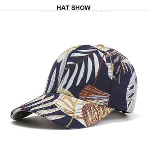 Detailed close-up of dark blue baseball cap with tropical palm leaf print pattern
