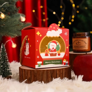 Red Christmas gift box with window handle and festive Santa illustration design