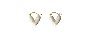 Detail of heart-shaped cream white shell texture enamel earrings with gold hardware