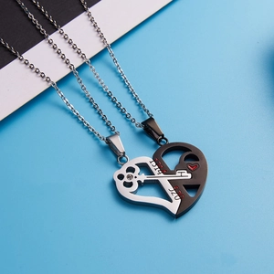 Detail of stainless steel puzzle heart necklace with 520 and 1314 engraving for couples