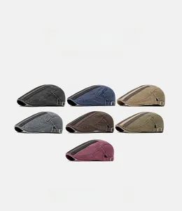 Selection of washed cotton flat caps in seven colors with side metal adjustment buckles