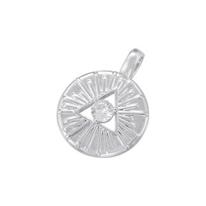 Macro shot of silver hip hop devil eye pendant with clear gemstone and radial textures