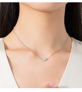 Close-up of S925 sterling silver evil eye necklace with turquoise and white crystals