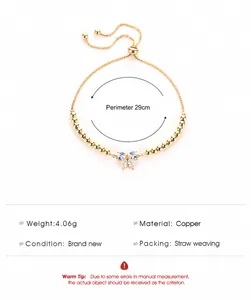 Detail showing adjustable copper bracelet with butterfly pendant and size measurements