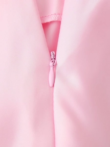 Close-up of pink satin fabric featuring a high-quality invisible zipper closure detail