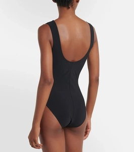 Detail of black one-piece swimsuit with deep scoop back and sleek fitted silhouette