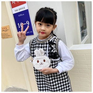 Detailed view of white plush bunny crossbody bag for kids with soft teddy fur texture