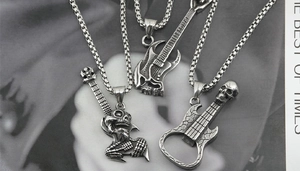 Detailed view of silver skull guitar pendants with square chains for men and women
