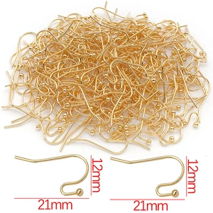 Macro view of gold-plated earring hooks showing 21mm x 12mm dimensions and metallic finish