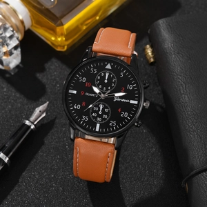 Geneva men's quartz watch with brown leather strap and black dial on office desk