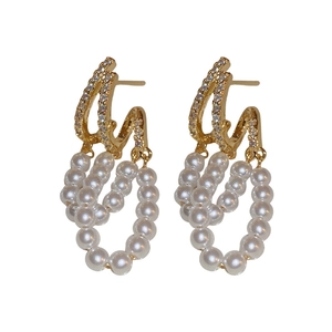 Elegant gold vintage earrings with double-layered rhinestones and white pearl tassels