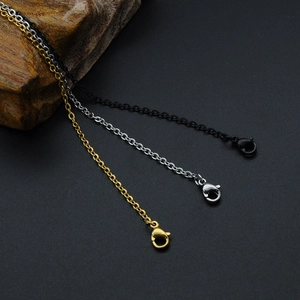 Detail view of O-chain necklaces in gold, silver, and black finish with lobster clasps