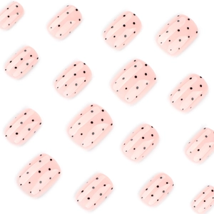 Short square press-on nails with light pink base and black polka dot pattern design
