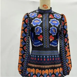 Detail of stand collar and ethnic print patterns on this long sleeve slim fit dress