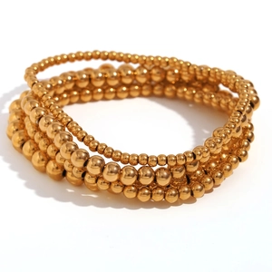 Stackable gold beaded elastic bracelets made of 18K gold plated stainless steel