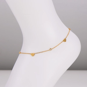 Golden stainless steel anklet with polished heart charms and sparkling crystals