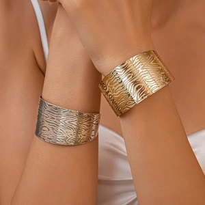 Irregular textured gold and silver chunky open cuffs with fluid embossed pattern