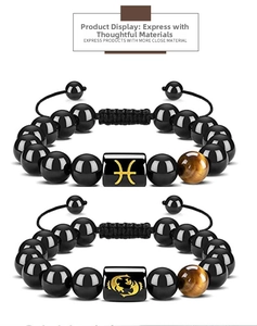 Detail view of adjustable black obsidian bracelet with tiger eye stone and Pisces symbol