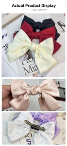 Detail of multi-color satin bow hair clips with metal spring back clip mechanism