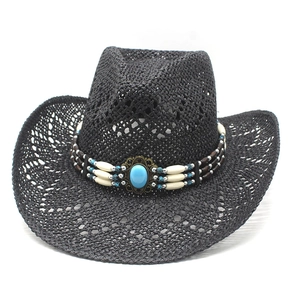 Detailed close-up of a black straw cowboy hat featuring turquoise beads and metal accents