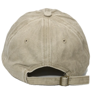 Detail of adjustable metal buckle and washed cotton texture on khaki baseball cap