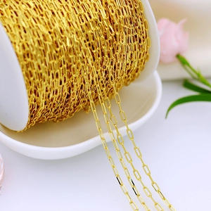 Macro view of 18K gold plated copper paperclip chain with heart detail for DIY jewelry