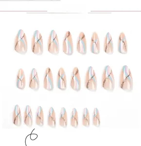 Detail of almond press-on nails with multi-color waves and gold glitter stripe accents