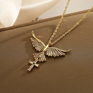 Detail of gold phoenix pendant with red stones and zircon cross on O-chain necklace