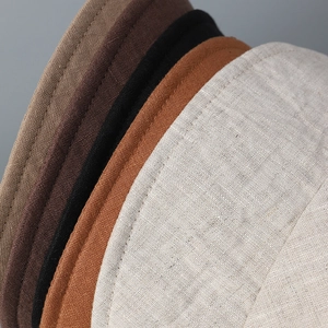 Detailed close-up showing diverse colors and natural linen texture of breathable sun hats