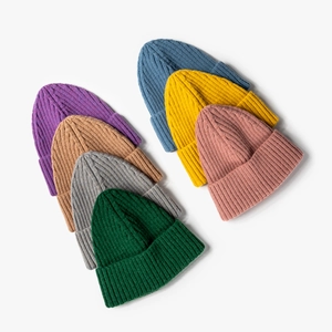 Colorful knitted beanies for men and women in various solid colors for winter warmth