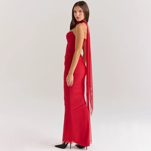 Detail of red bodycon dress featuring halter neck tie and soft flowing fabric texture