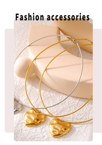 Detailed view of lava heart pendants in gold and silver on snake bone chain necklaces