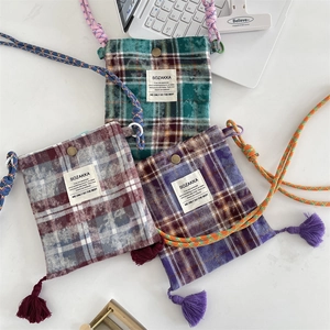 Trio of vintage plaid crossbody phone bags with tassel detail and colorful rope straps