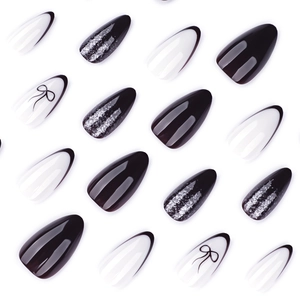 Y2K French black and white press-on nails with silver glitter and bow designs
