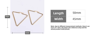 Detail view of 50mm x 45mm golden triangle hoop earrings in polished titanium steel
