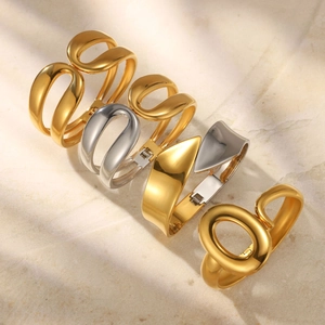 Organic fluid hollow spring bangles in 18k gold and silver stainless steel set