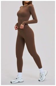 Detail of high-waist yoga leggings and long-sleeve top in chocolate brown matte fabric