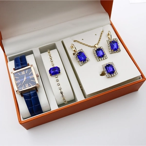 Detailed luxury gift set featuring blue stone square watch and matching jewelry in a gift box