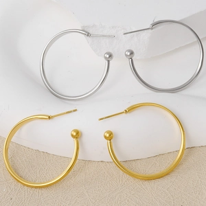 Detailed view of 304 stainless steel gold and silver hoop earrings with ball ends
