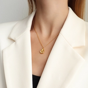 Elegant gold-tone irregular waterdrop pendant necklace in polished titanium steel