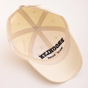 Detail view of cotton baseball cap interior showing six-panel stitch and sweatband
